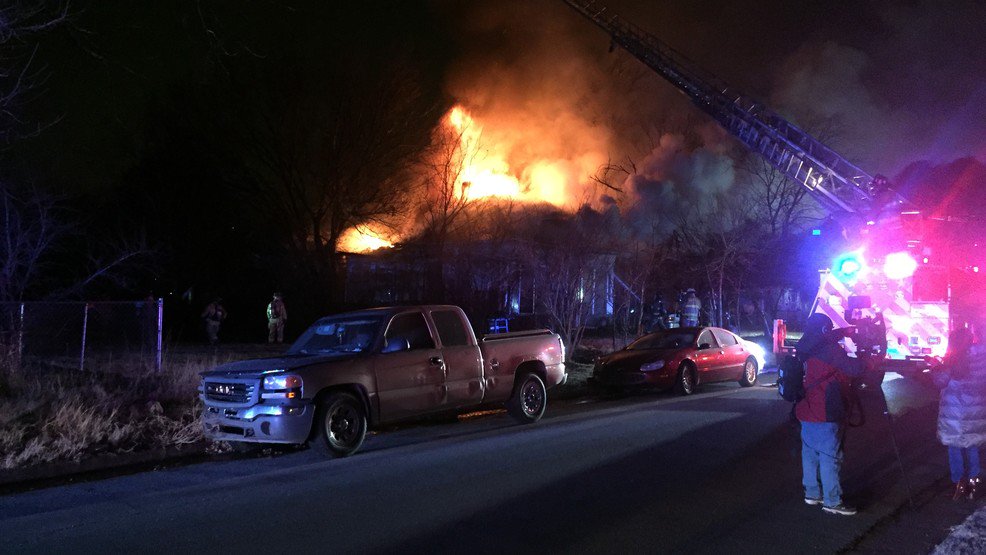 Fire crews are battling a large blaze tearing through a metro home. Oklahoma City firefighters were called out just before 6 a.m. for reports of a house fire near NW 95th and Walker Ave. Arriving crews reported upwards of 60-foot flames shooting through the roof of the home.