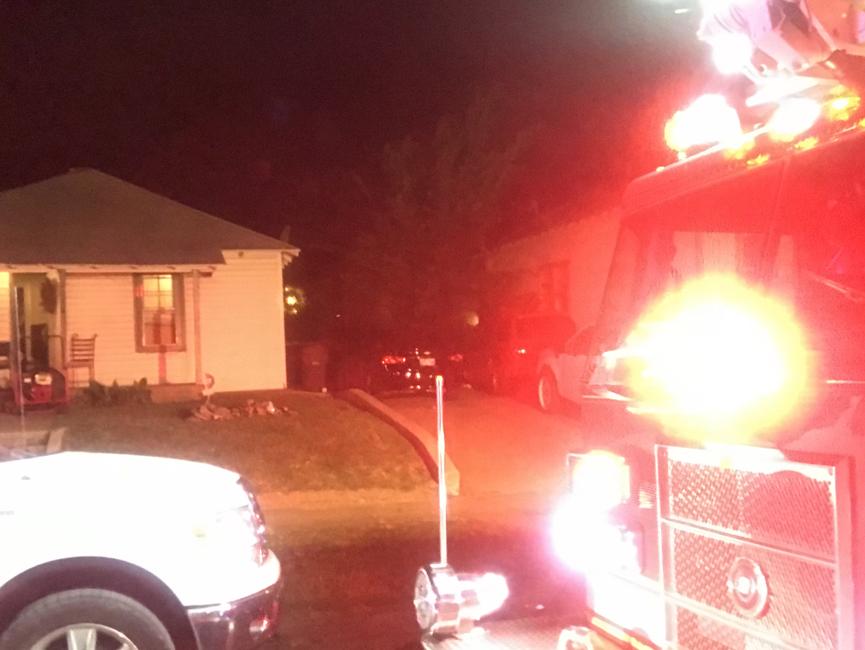 Sirens can be heard after neighbors call 911 to report smoke rolling from the front door of a home near Pine and Utica.