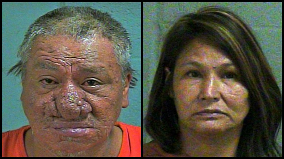 Two people were taken into custody after police say they were having sex on the ground near a busy Oklahoma City intersection.