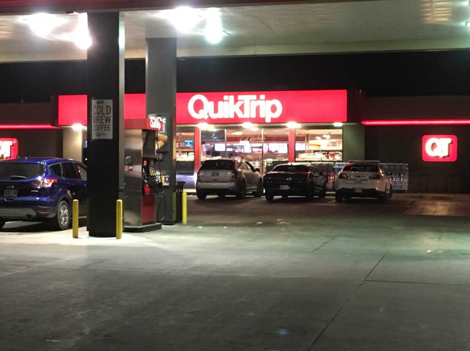 Tulsa police say a man stole beer from an east Tulsa QuikTrip, left the store, came back and started attacking employees with another suspect who had a gun.