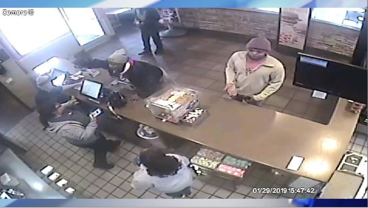 Police are searching for a pair of suspects who allegedly attacked a fast-food worker last month.