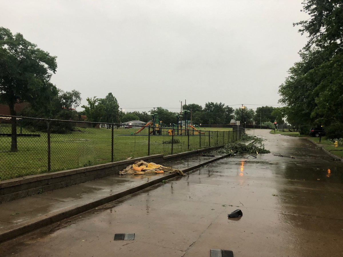 Damage around Celia Clinton Elementary in Tulsa after possible tornado. Damaged railroad crossing at pine and Harvard caused freight train to stop, blocking traffic. 