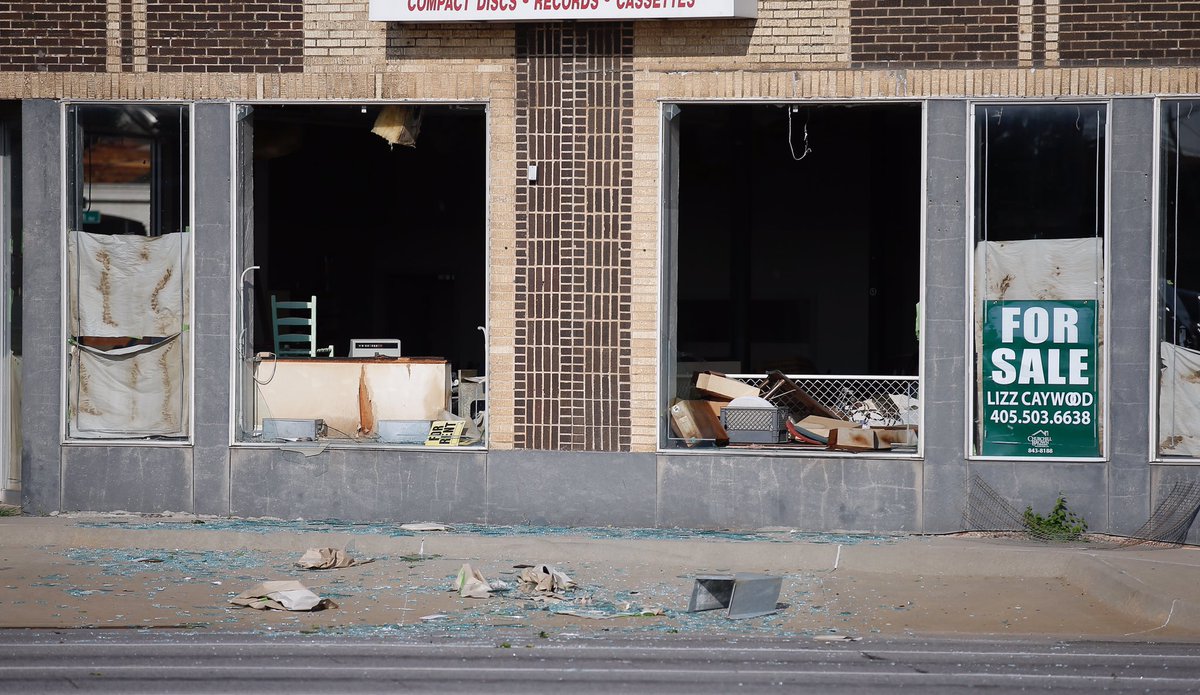 Damage at 23rd and Classen st the Rainbow building and a bus shelter across the street  