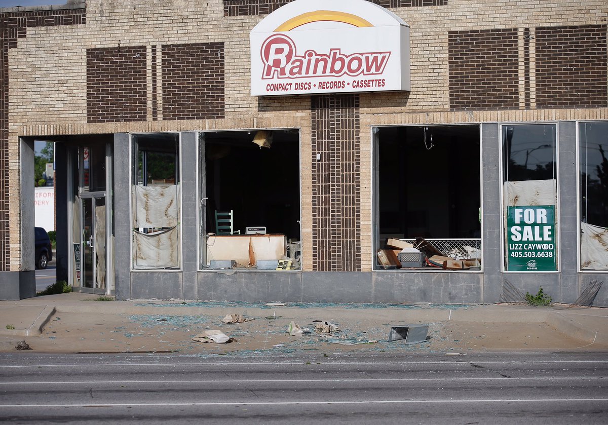 Damage at 23rd and Classen st the Rainbow building and a bus shelter across the street  