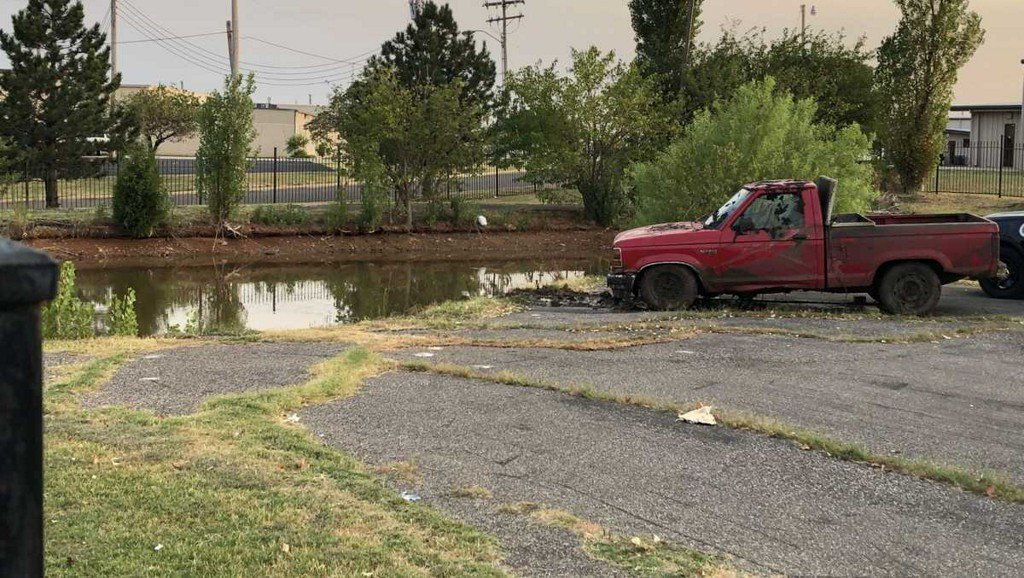 Two bodies found inside vehicle pulled from pond in Moore, police say