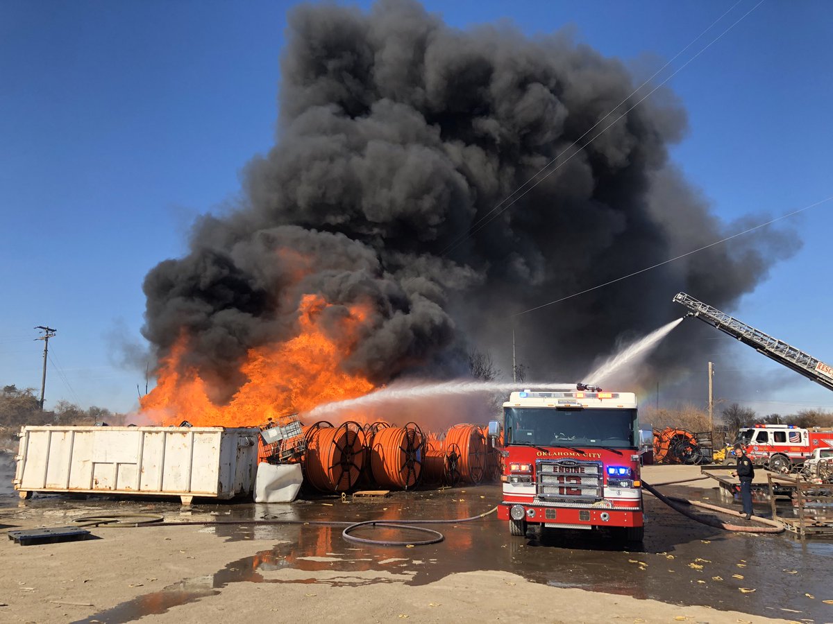 Commercial Fire   201 N. Wisconsin Ave.   Firefighters are on scene of a large fire involving rolls of irrigation tubing.  This fire is putting off a large plume of smoke but is contained to the area. 