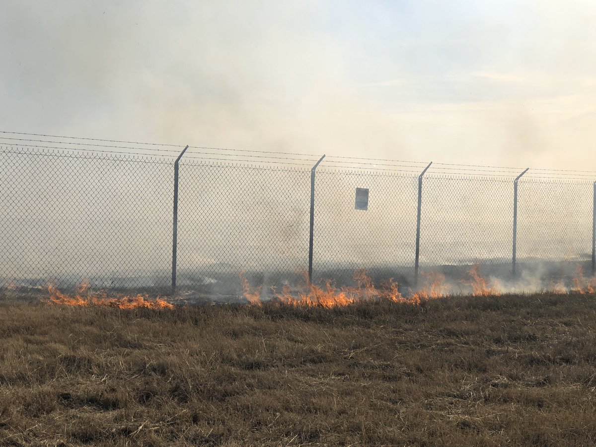 TAC 8 | Grass Fire | Firefighters from OKC and Will Rogers Airport FD have the forward progress of this fire stopped. There have been no structures damaged and the flight line of WRWA are not affected.  Crews are hitting hot spots now