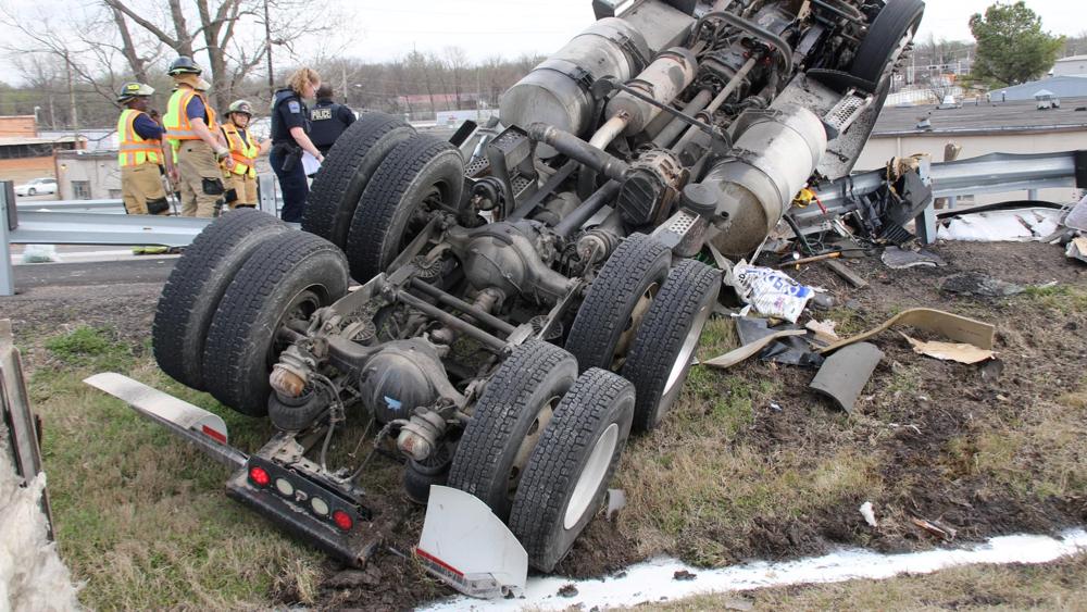 Tulsa Fire Department, Tulsa Police Department, EMSA OKLAHOMA, Allied Wrecker, and other agencies are currently on the scene of an overturned semi. The truck was carrying a load of milk. The driver was transported for more thorough examinations but was talking to crews and appeared to have non life threatening injuries