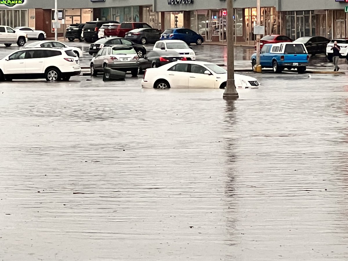 Flood Ave and Main St is closed due to flooding. At least one car is stuck. According to the City of Norman this area is known to flood because of local drainage problems in older parts of the city