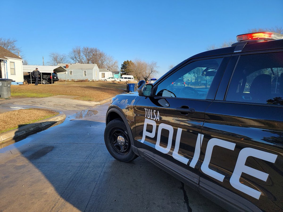 There's a heavy police presence near Apache and Peoria as Officers are working to take a man into custody, believed to be hiding in a house after shooting a woman early this morning